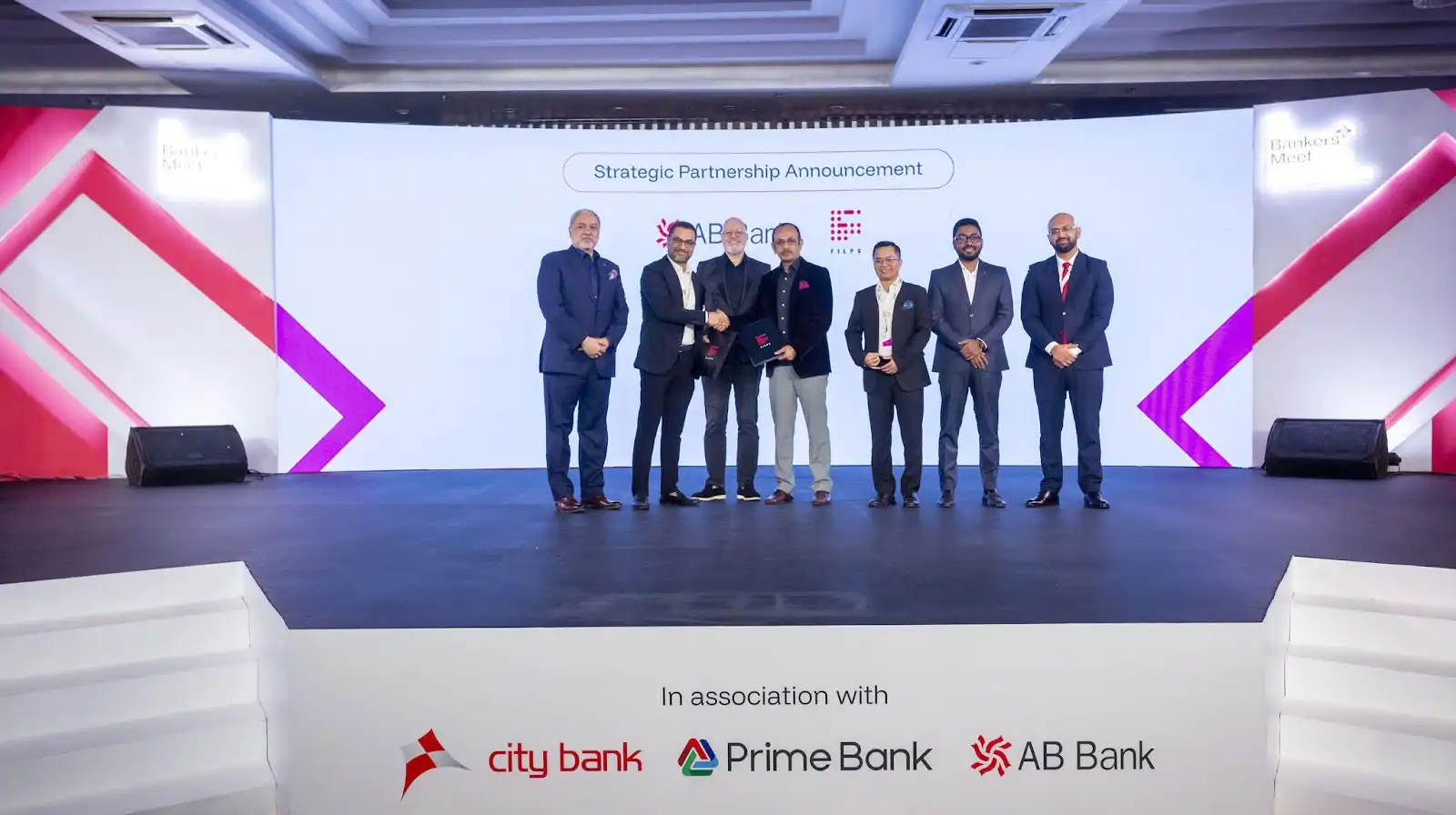 A group picture of representatives from Filps and AB Bank PLC, Bangladesh including Filps CEO Biswas Dhakal, Filps Country Manager in Bangladesh, Tushar Hasan, Filps Chief Strategy Officer Daniel D Shrestha, Filps Board Advisor Brett King, and AB Bank MD & CEO Syed Mizanur Rahman, among others.